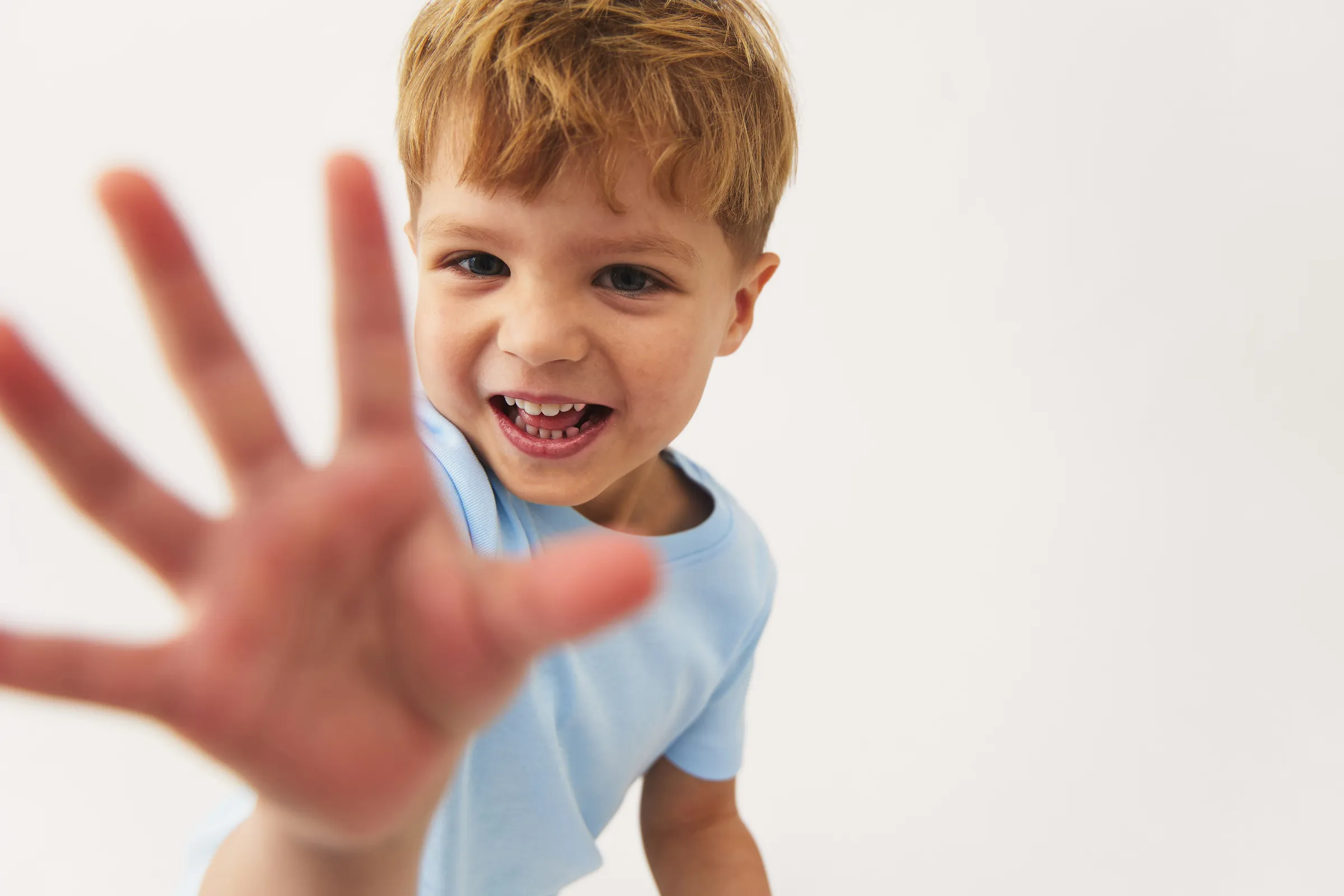 Petit by basics brand imagery: Timeless essentials for children in natural fibers, with a soft Nordic color palette.
